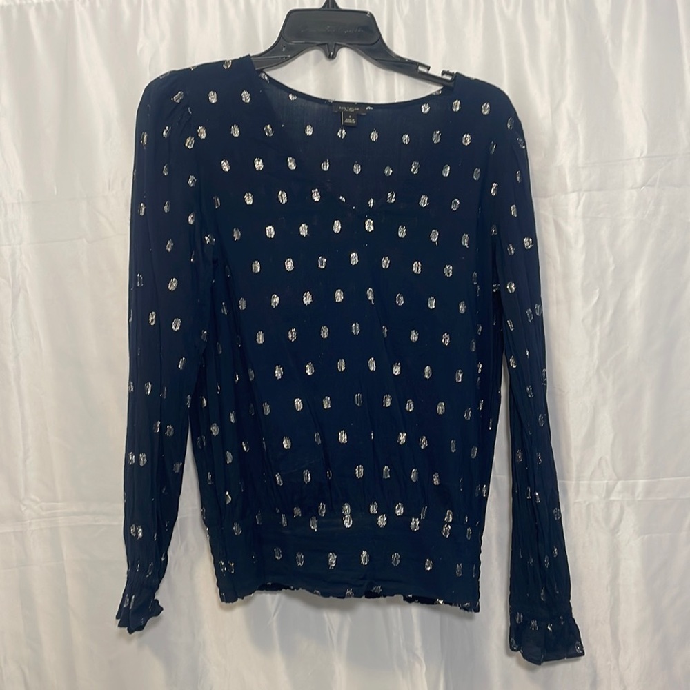 Navy blue with metallic silver clip dot pattern. Semi sheer with long sleeves.